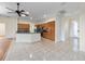 Open floor plan with kitchen island, wood cabinets, and a view into the foyer at 2699 Nw 58Th Terrace, Ocala, FL 34482
