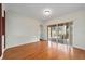 Living area with hardwood floors and sliding glass doors to backyard at 2699 Nw 58Th Terrace, Ocala, FL 34482