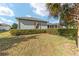Landscaped backyard with privacy hedge and lush grass at 2699 Nw 58Th Terrace, Ocala, FL 34482