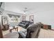 Living room with black leather reclining sofas and a view of a bedroom at 36 Cedar Tree Ter, Ocala, FL 34472