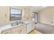 Efficient kitchen layout with stainless steel sink and sliding glass door at 4 Pine Way Pl, Ocala, FL 34472