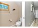 View of the half bath with coastal decor and a toilet at 4500 Sw 52Nd Cir # 104, Ocala, FL 34474