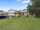 House exterior showcasing a single-story home with a garage and a front yard at 58 Bahia Court Trak, Ocala, FL 34472