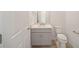 Small bathroom with toilet and a vanity with single sink at 5886 Sw 78Th Avenue Rd, Ocala, FL 34474