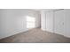Bright bedroom with neutral carpeting and double door closet at 5886 Sw 78Th Avenue Rd, Ocala, FL 34474