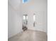Bright entryway with tile flooring, staircase, and front door at 5886 Sw 78Th Avenue Rd, Ocala, FL 34474