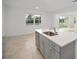 Kitchen island with sink and granite countertop at 5886 Sw 78Th Avenue Rd, Ocala, FL 34474