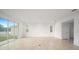 Spacious living room with tile floors and sliding glass doors at 5886 Sw 78Th Avenue Rd, Ocala, FL 34474