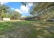 Large backyard with screened enclosure and shed at 6556 Se 173Rd Ct, Ocklawaha, FL 32179