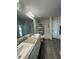 Bathroom with double vanity, shower, and bathtub at 7703 Sw 103Rd Loop, Ocala, FL 34476