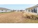 Backyard view showing grass and neighborhood homes at 8916 Sw 78Th Street Rd, Ocala, FL 34481