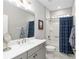 Clean bathroom with single vanity, tub shower combo, and updated fixtures at 8916 Sw 78Th Street Rd, Ocala, FL 34481