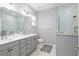 Elegant bathroom with double vanity, large shower, and marble tile at 8916 Sw 78Th Street Rd, Ocala, FL 34481