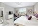 Spacious bedroom with large bed, dresser, and plenty of natural light at 8916 Sw 78Th Street Rd, Ocala, FL 34481
