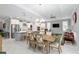 Spacious dining area with kitchen access and view to living room at 8916 Sw 78Th Street Rd, Ocala, FL 34481