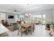 Bright dining room with wooden table and chairs near living room at 8916 Sw 78Th Street Rd, Ocala, FL 34481