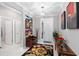 Elegant entryway, featuring decorative wall art and a wooden bench at 8916 Sw 78Th Street Rd, Ocala, FL 34481