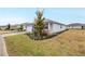 Side view of a one-story house with a well maintained lawn and landscaping at 8916 Sw 78Th Street Rd, Ocala, FL 34481