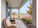 View from the front porch with wicker chairs and a view of the neighborhood at 8916 Sw 78Th Street Rd, Ocala, FL 34481