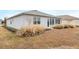 House exterior showcasing back sunroom and yard at 8916 Sw 78Th Street Rd, Ocala, FL 34481