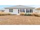 House exterior showcasing back sunroom and yard at 8916 Sw 78Th Street Rd, Ocala, FL 34481