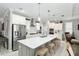 Modern kitchen with large island and stainless steel appliances at 8916 Sw 78Th Street Rd, Ocala, FL 34481