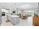 Modern kitchen with island, white cabinets, and stainless steel appliances at 8916 Sw 78Th Street Rd, Ocala, FL 34481