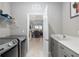 Laundry room with washer, dryer, and access to living area at 8916 Sw 78Th Street Rd, Ocala, FL 34481