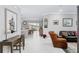 Open living area with hardwood floors and view of kitchen at 8916 Sw 78Th Street Rd, Ocala, FL 34481