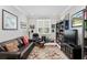 Home office with leather seating, built-in shelving and window at 8916 Sw 78Th Street Rd, Ocala, FL 34481