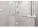Walk-in shower with marble tile and a convenient seat at 8916 Sw 78Th Street Rd, Ocala, FL 34481