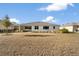 Large backyard with grass and a small tree at 9725 Sw 108Th Terrace Rd, Ocala, FL 34481