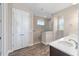 Bathroom boasts double vanity, walk-in shower, and hardwood floors at 9725 Sw 108Th Terrace Rd, Ocala, FL 34481