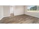 Bright bedroom with hardwood floors and large window at 9725 Sw 108Th Terrace Rd, Ocala, FL 34481