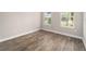 Charming bedroom with hardwood floors and dual windows at 9725 Sw 108Th Terrace Rd, Ocala, FL 34481