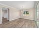 Bright dining room with hardwood floors and sliding glass doors to patio at 9725 Sw 108Th Terrace Rd, Ocala, FL 34481