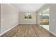 Dining room with hardwood floors, sliding glass doors, and chandelier at 9725 Sw 108Th Terrace Rd, Ocala, FL 34481