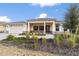Single-story home with a covered porch and landscaped yard at 9725 Sw 108Th Terrace Rd, Ocala, FL 34481