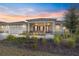 Single-story home with covered porch, two-car garage, and landscaped yard at 9725 Sw 108Th Terrace Rd, Ocala, FL 34481