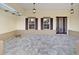 Covered front porch with paver floor and stylish entry door at 9725 Sw 108Th Terrace Rd, Ocala, FL 34481