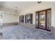 Covered front porch with paver floor and stylish entry door at 9725 Sw 108Th Terrace Rd, Ocala, FL 34481