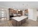 Modern kitchen with large island and stainless steel appliances at 9725 Sw 108Th Terrace Rd, Ocala, FL 34481