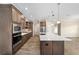 Modern kitchen with stainless steel appliances and hardwood floors at 9725 Sw 108Th Terrace Rd, Ocala, FL 34481
