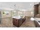 Modern kitchen featuring island, stainless steel appliances, and hardwood floors at 9725 Sw 108Th Terrace Rd, Ocala, FL 34481