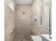 Walk-in shower with pebble floor and built-in seat at 9725 Sw 108Th Terrace Rd, Ocala, FL 34481