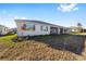 Single-story home with screened-in patio and grassy yard at 9739 Sw 79Th Lane Rd, Ocala, FL 34481