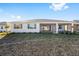 Single-story home with screened patio and grassy yard at 9739 Sw 79Th Lane Rd, Ocala, FL 34481