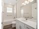 Bathroom with white vanity, tub, and shower at 9739 Sw 79Th Lane Rd, Ocala, FL 34481