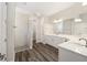 Double vanity bathroom with a large walk-in shower and white cabinets at 9739 Sw 79Th Lane Rd, Ocala, FL 34481