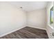 Bright bedroom with wood-look floors and window at 9739 Sw 79Th Lane Rd, Ocala, FL 34481